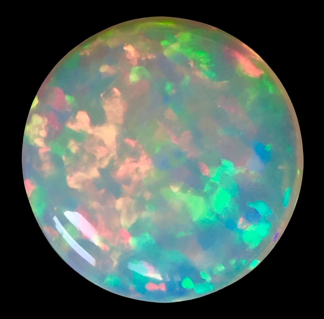 14.15 exceptional Welo Opal with perfect cabochon cut and polishing. No dead spots and two sided color. Ethiopia old mine stock. Our finest. 